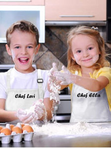 Kids baking with flour all over and custom apron with their names 
